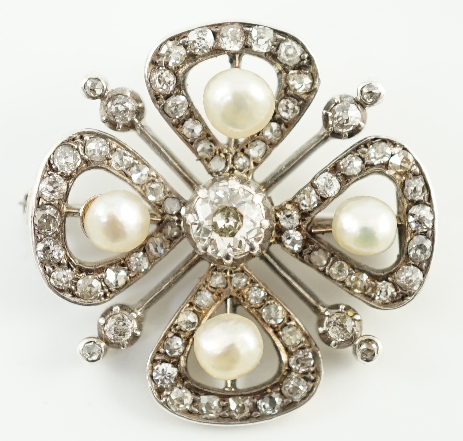 An Edwardian gold and platinum, diamond and four stone button pearl cluster set 'clover' brooch